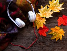 Headphones laying on fall leaves