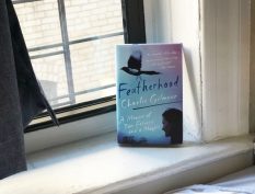 Featherhood book resting by a window
