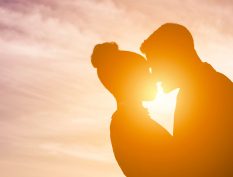 Couple embracing in a sunset