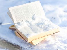 Pile of snow on an open book