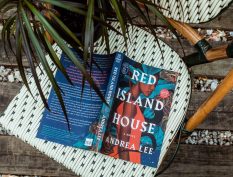 Red Island House book with a plant