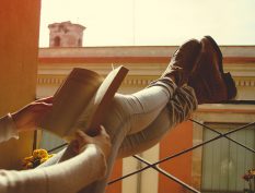 Reading on a balcony