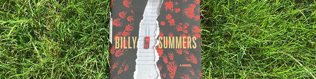 Billy Summers by Stephen King laying in the grass