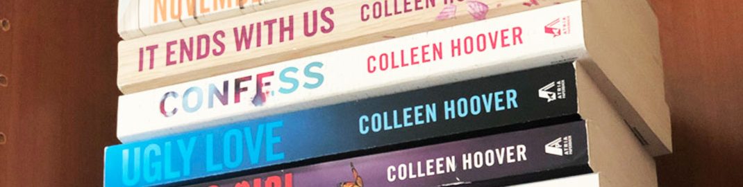 Colleen Hoover books stacked on a shelf