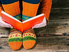 Reading a book with cozy socks