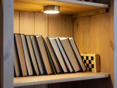 Bookshelf with a light shining on it