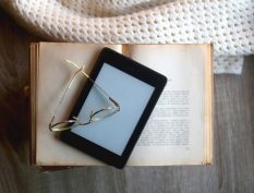 eBook resting an a physical book